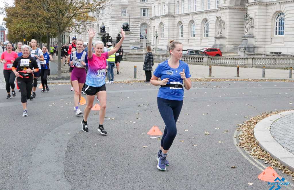 photo of two people running in Claire House t-shirts