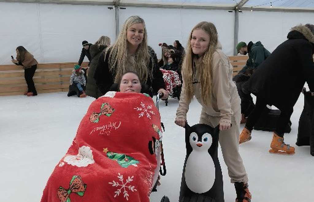 Claire House family on an Ice Skating rink