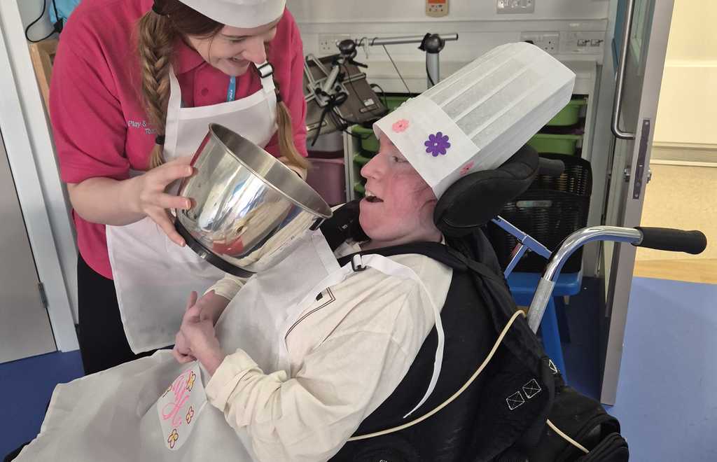 Faye - young adult supported by Claire House - baking hospice shortbread during her respite stay.