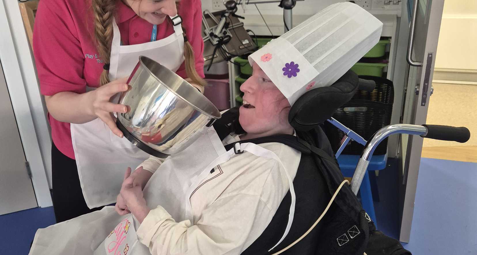 Faye - young adult supported by Claire House - baking hospice shortbread during her respite stay.