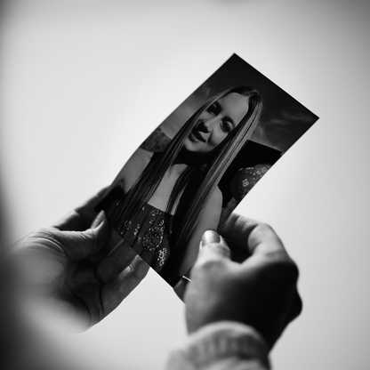 Amanda holding an old photo of Izzy