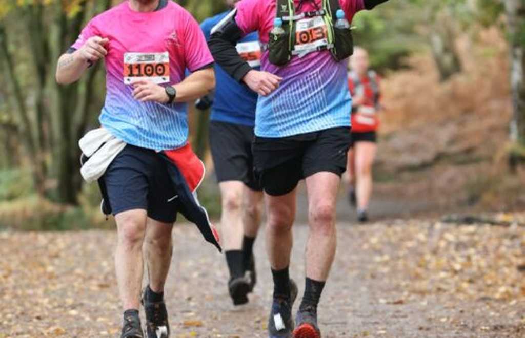 two people running in claire house running tops